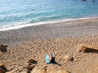 Sunbathing at the beach near Paphos Aphrodite Sands Resort