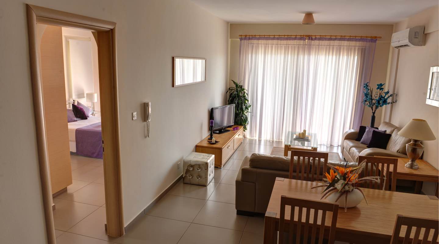 Living room of one bedroom apartment at Paphos Aphrodite Sands Resort